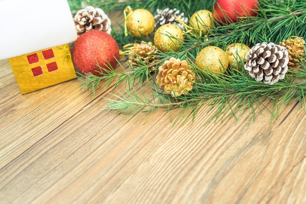 Christmas fir tree on wooden board background with copy space