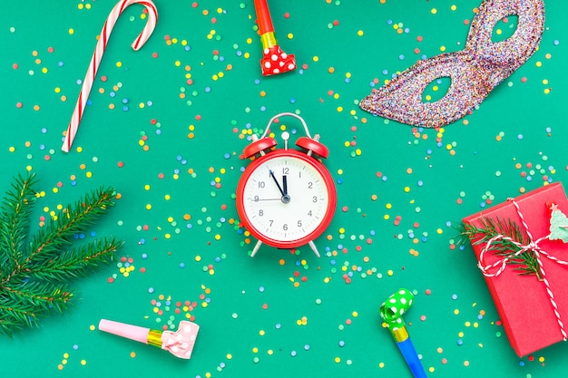 Christmas flat lay with red alarm clock