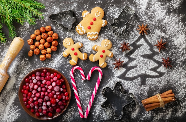 Christmas food Ingredients for Christmas baking  fir tree made from flour cranberries and cookies