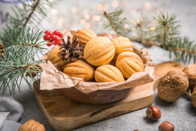 Christmas food. Shortbread walnut shaped cookies oreshki with caramel.