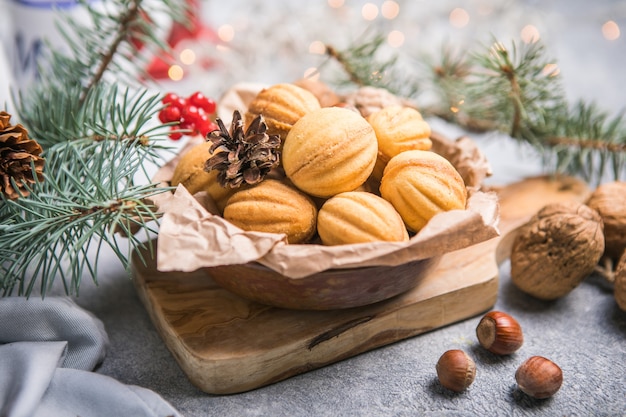 Christmas food. Shortbread walnut shaped cookies oreshki with caramel.