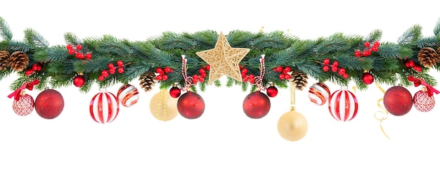 Christmas garland with golden start red balls cones and berries on isolated white background