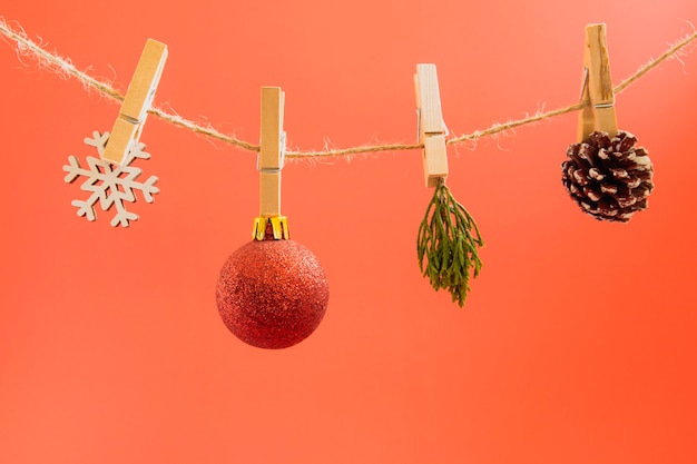 Christmas garlands on a rope on a red background