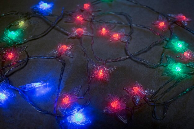 Christmas garlands with glowing light bulbs