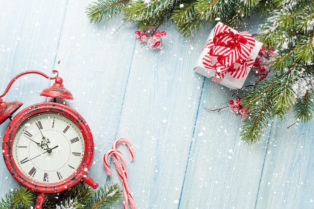 Christmas gift box alarm clock candy cane and fir tree