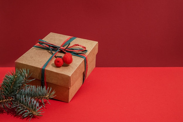 Christmas gift box and pine tree branch