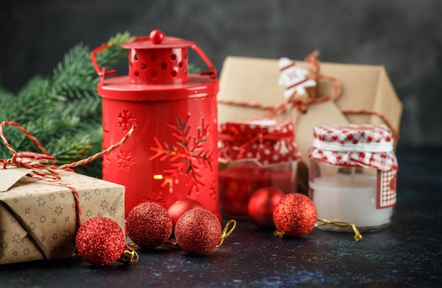 Christmas gift box, red lantern with candle, red balls and decoration light