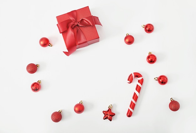 Christmas gift box with lollipops and toys isolated