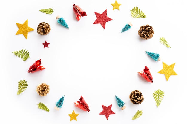 Christmas gift box with red star and pine cones on white background.