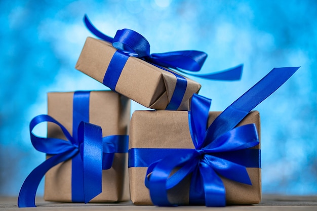 Christmas gift boxes against blue bokeh