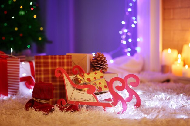 Christmas gift boxes and decoration on the soft carpet, indoor