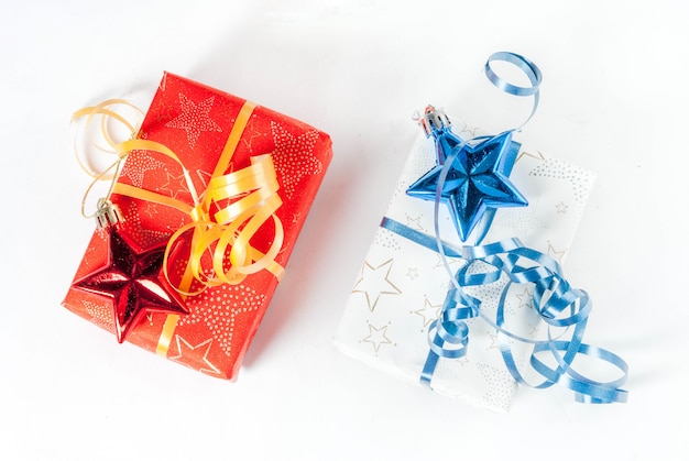 Christmas gift boxes and decorations on white background, top view