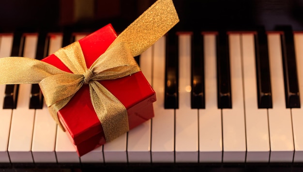 Christmas gift on a piano keyboard above view