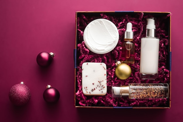 Christmas gift set xmas holidays beauty box subscription package and luxury skincare products flatlay cosmetic flat lay on pink background cosmetics as holiday present or shopping delivery