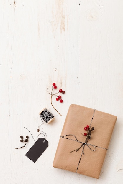 Christmas gift wrapped in craft and decorated with various natural things DIY present idea