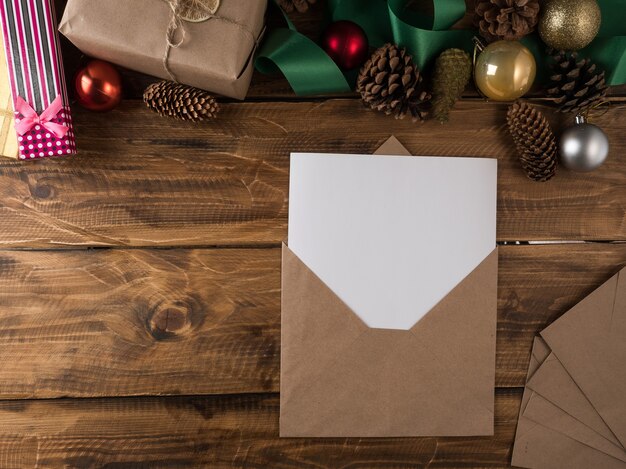 Christmas gifts and letters on the table. Top view, copy space.