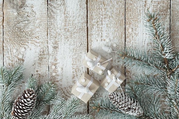 Christmas gifts on old white wooden background