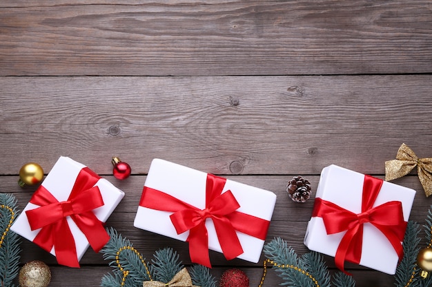 Christmas gifts presents with decorations on a grey background.