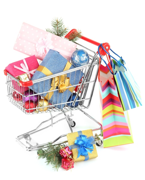 Christmas gifts in shopping trolley, isolated on white