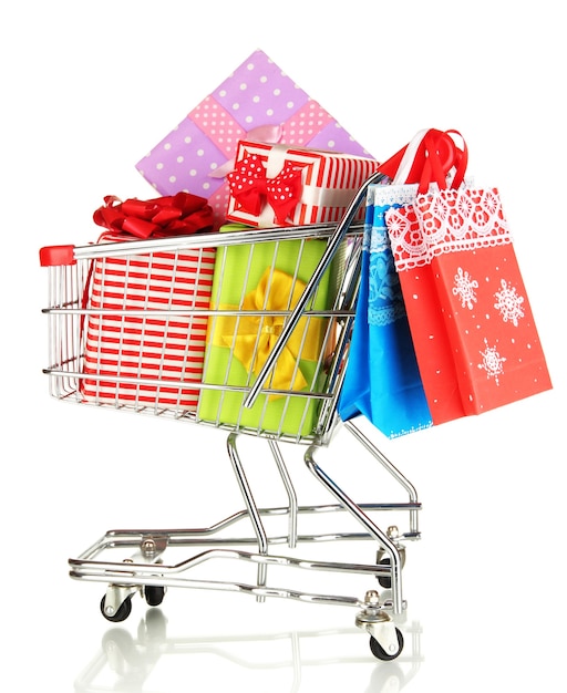 Christmas gifts and shopping in trolley isolated on white