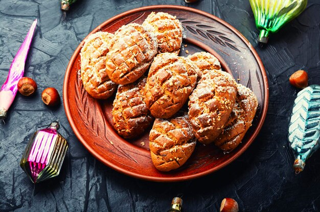 Christmas gingerbread or pastry and Christmas tree decorations for the winter holidays. Cookies