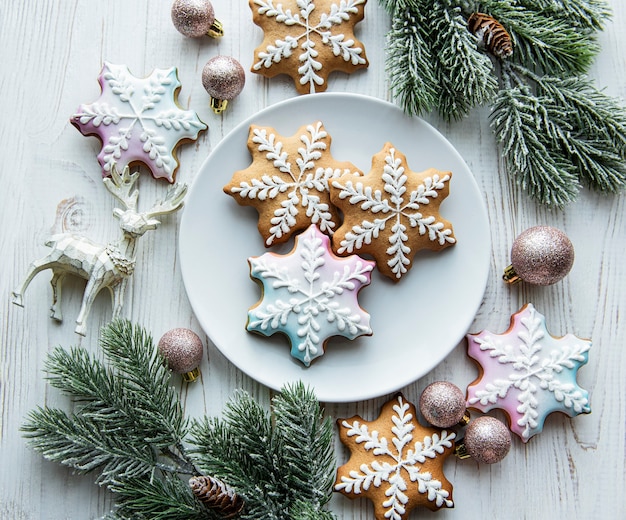 Christmas gingerbread in the plate and holiday decorations