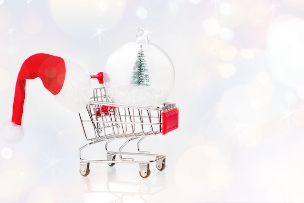 Christmas glass ball with a miniature Christmas tree Christmas sale Supermarket trolley