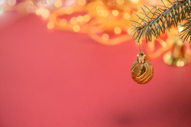 Christmas Golden ball on red background