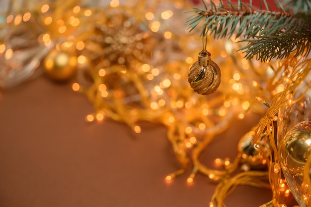 Christmas Golden ball on a spruce branch 