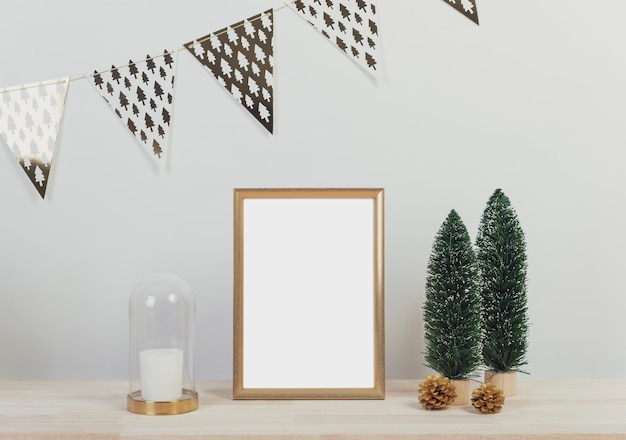 Christmas holiday greeting frame design mockup with decoration on wood table.