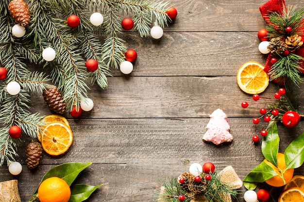 Christmas holiday ornaments on rustic wooden background.