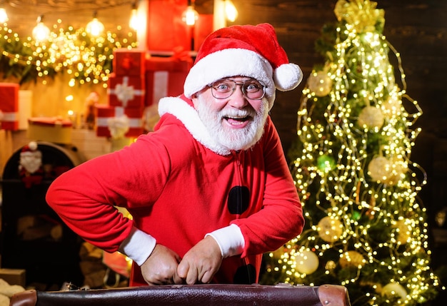 Christmas holidays happy santa claus with suitcase new year travel tourist trip vacation