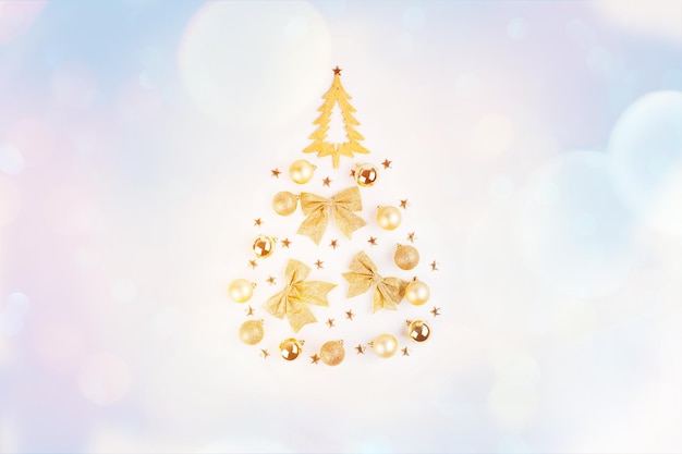 Christmas home decor of a woodenChristmas tree on a light background withNew Year's decorations