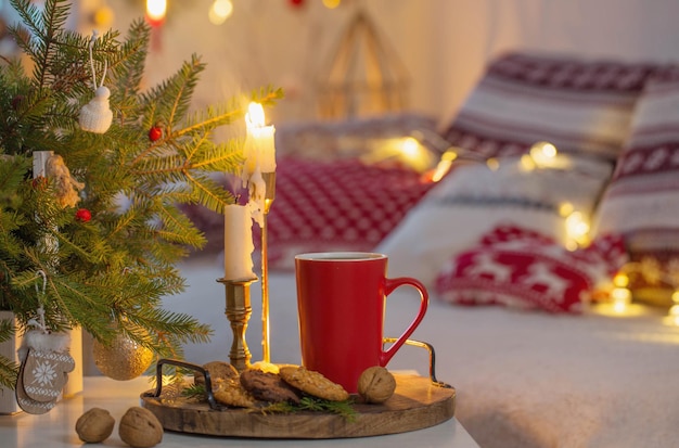 Christmas home decorations with candles in red and white colors