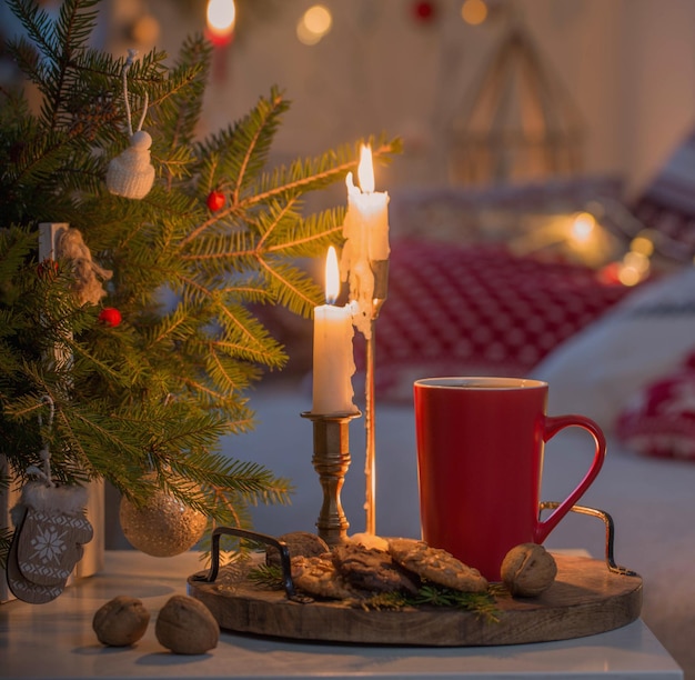 christmas home decorations with candles in red and white colors