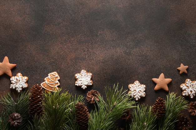 Christmas homemade assorted glazed cookies on brown background