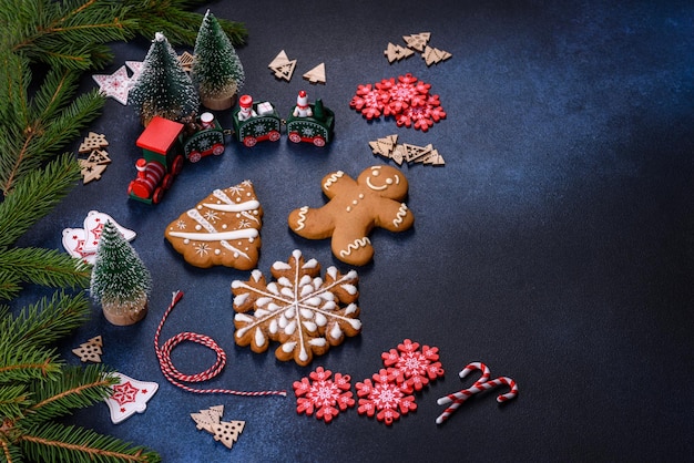 Christmas homemade gingerbread cookies on a dark concrete table table