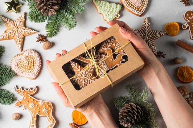 Christmas homemade gingerbread cookies in a gift box on a grey table