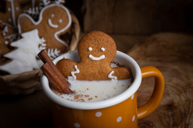 Christmas homemade gingerbread cookies, gingerbread man on wooden table