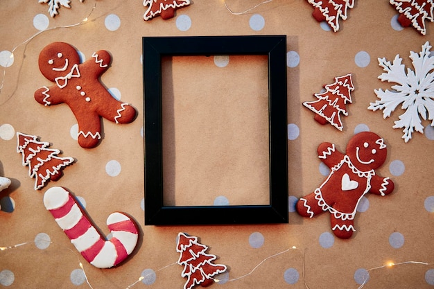 Christmas homemade gingerbread cookies with mock up frame Homemade baking cookies Festive aesthetic card Christmas atmosphere Merry Christmas and home coziness concept