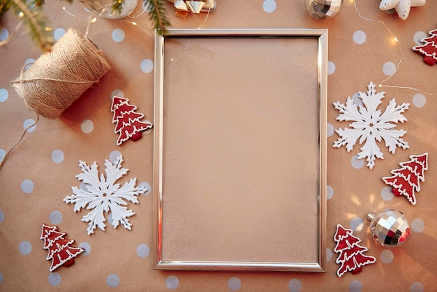 Christmas homemade gingerbread cookies with mockup frame Homemade baked cookies and fir tree Festive aesthetic mock up Christmas atmosphere Merry Christmas and home coziness concept