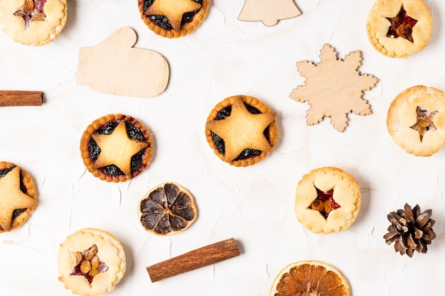 Christmas homemade mince pies flat lay on white cement background