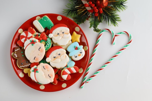 Christmas icing sugar cookies with white background and ornaments.