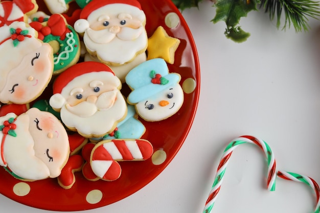 Christmas icing sugar cookies with white background and ornaments.