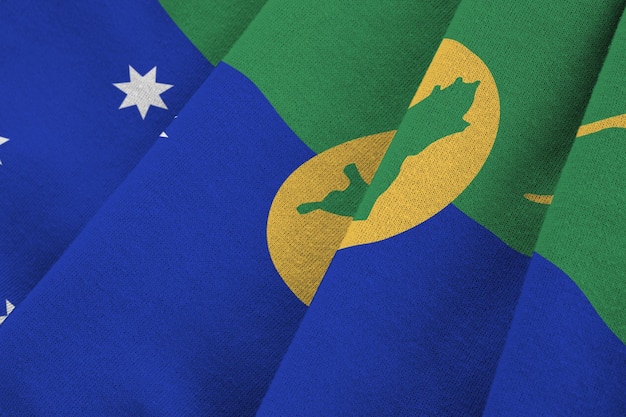 Christmas island flag with big folds waving close up under the studio light indoors The official symbols and colors in banner