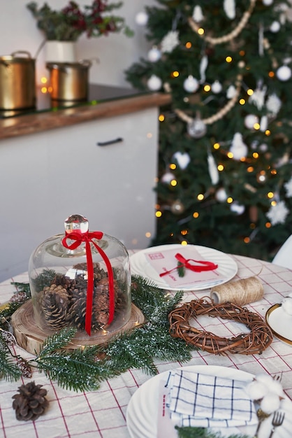 Christmas kitchen and table. Red, green and white decor christmas tree background. New Year celebration. Merry Christmas and Happy New Year.