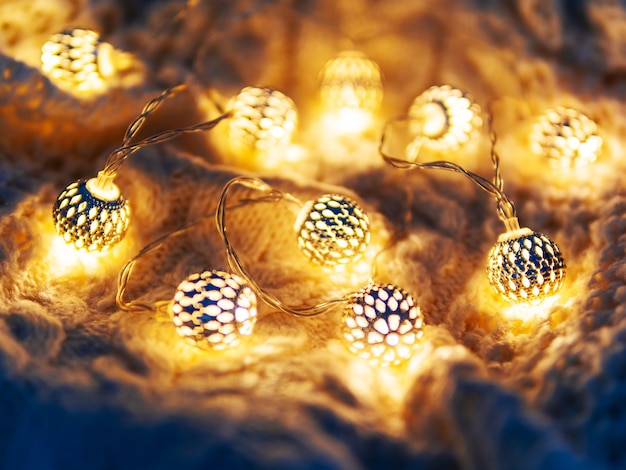 Christmas  knitted   light bulbs. Cozy holiday decorations.