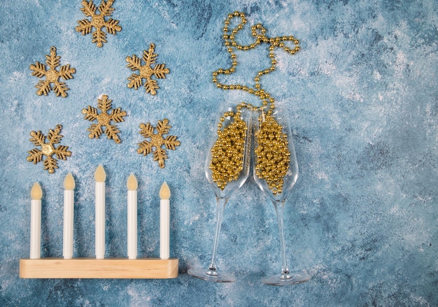 Christmas lamp in the form of candles decorationssnowflakes on a blue background