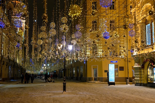 Christmas lanterns on the city street The snowstorm