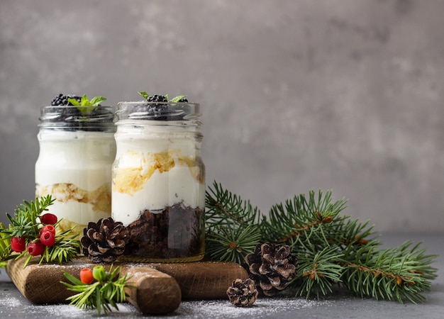 Christmas layered dessert with cream cheese, cookies and berries